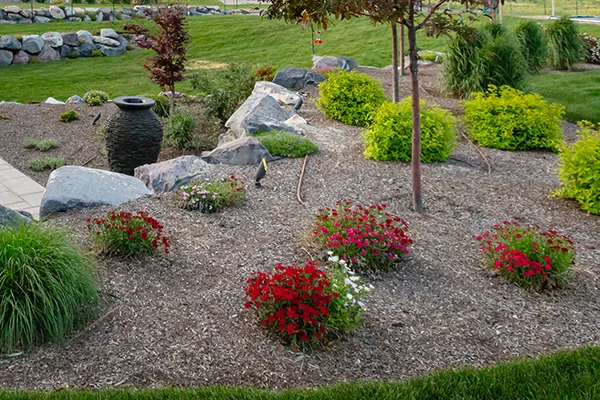 Perennials and annuals planted in a backyard by Jones Outdoors