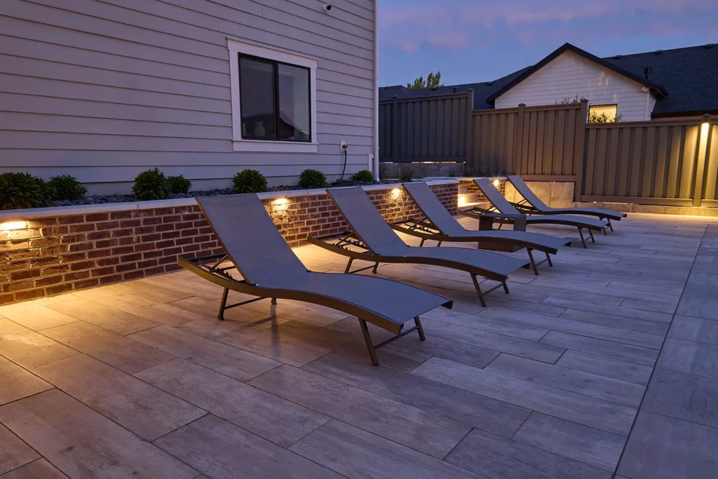 lounge chairs on a pool-side patio